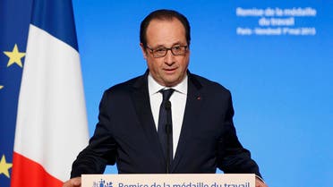 French President Francois Hollande during a Working Medal of Honor awards ceremony on May Day at the Elysee Palace, in Paris, France, May 1, 2015. (Reuters)