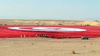 Tunisians unfurl world’s ‘largest’ flag