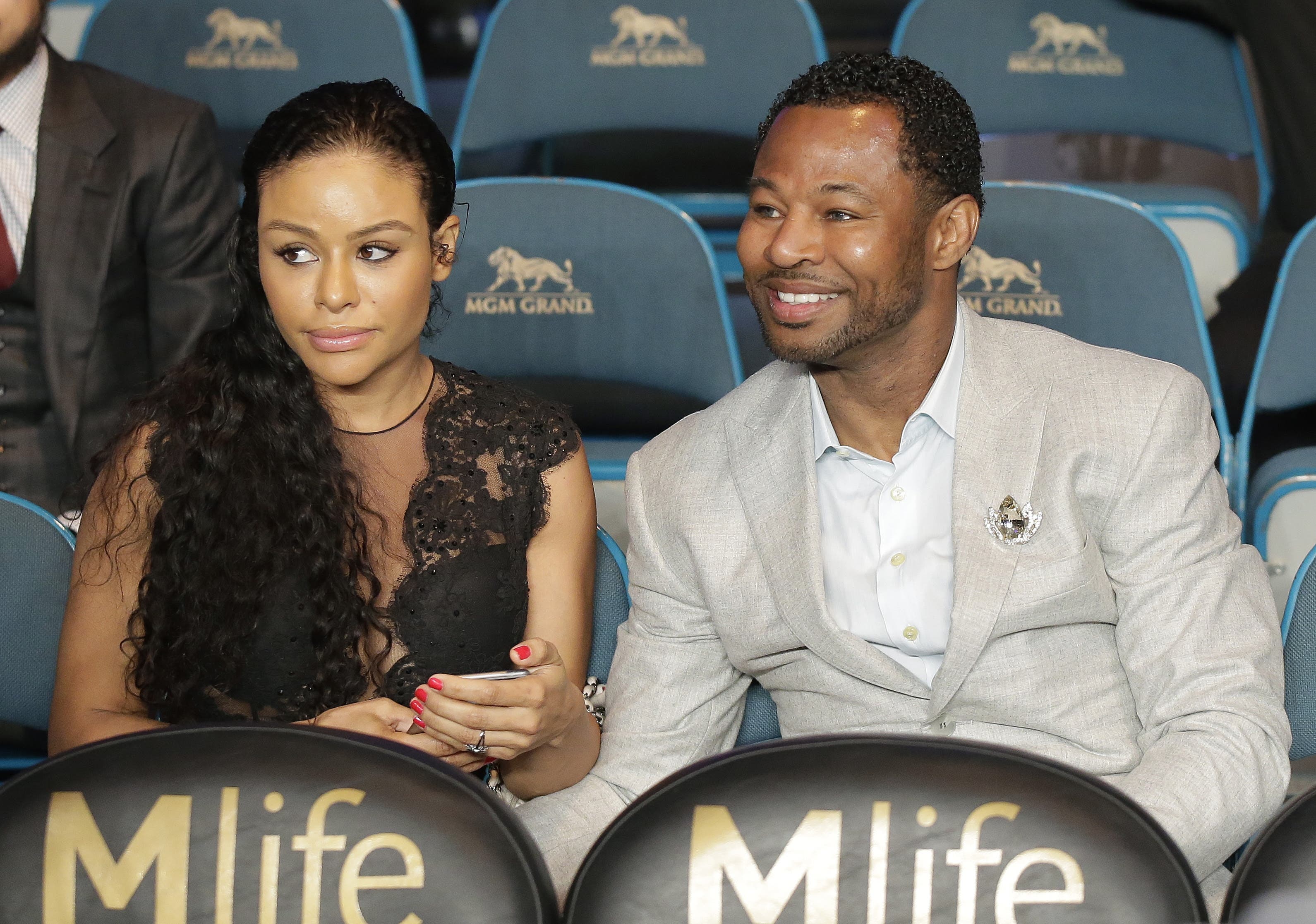 Boxer Shane Mosley, right, is joined by Bella Gonzalez before the start of the world welterweight championship. (AP)
