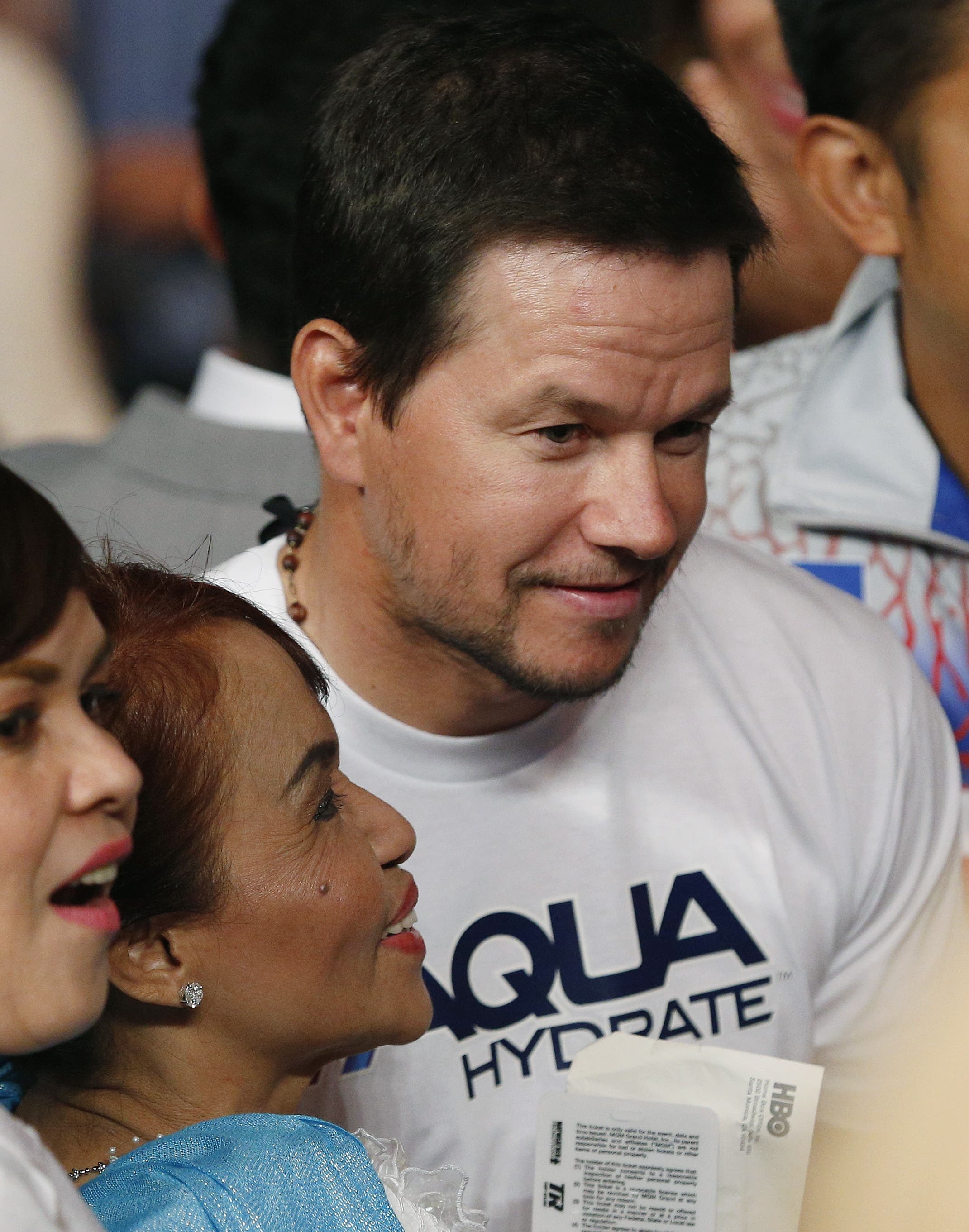 Actor Mark Wahlberg joins the crowd before the start of the world welterweight championship. (AP)