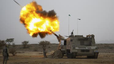 Saudi army artillery fire shells towards Houthi movement positions at the Saudi border with Yemen. (Reuters)