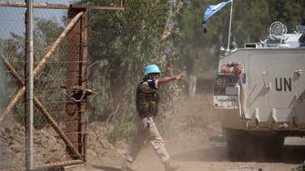 Two U.N. men hit by Syria fire on Israeli-held Golan