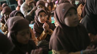 Sexes separated in Indonesian province's schools, next up motorbikes