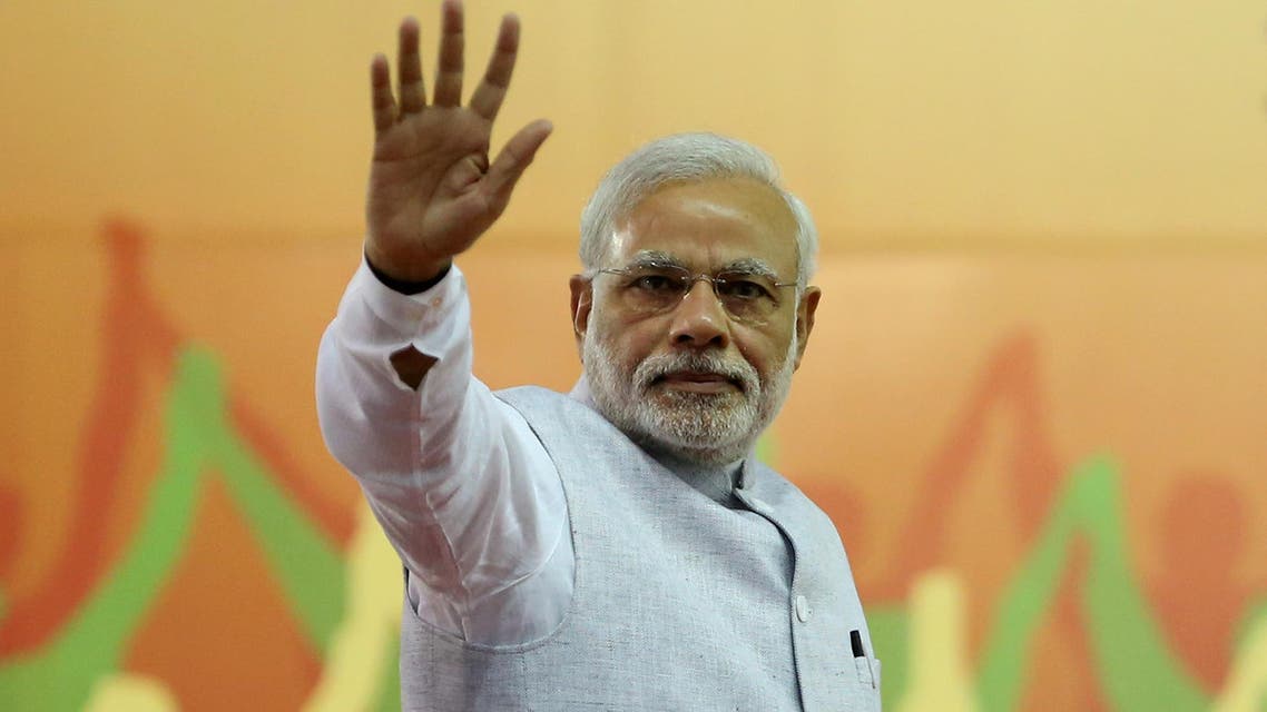 India's Prime Minister Narendra Modi waves to his supporters after addressing a rally organized by his party, the ruling Bharatiya Janata Party (BJP), in Bangalore, India, Friday, April 3, 2015. Modi's speech was mostly addressed to farmers on a day that President Pranab Mukherjee signed off on the latest version of the government's land acquisition ordinance, which proposes to ease rules for acquiring land to facilitate infrastructure projects, in a country where agriculture is the main livelihood of about 60 percent of the 1.2 billion people. (AP Photo/Aijaz Rahi)