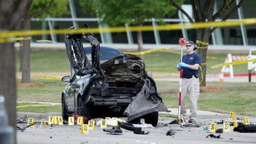 An FBI crime scene investigator documents evidence outside the Curtis Culwell Center, Monday, May 4, 2015, in Garland, Texas. (AP)