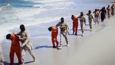 Islamic State militants lead what are said to be Ethiopian Christians along a beach in Wilayat Barqa, in this still image from an undated video made available on a social media website on April 19, 2015. The video purportedly made by Islamic State and posted on social media sites on Sunday appeared to show militants shooting and beheading about 30 Ethiopian Christians in Libya. Reuters was not able to verify the authenticity of the video but the killings resemble past violence carried out by Islamic State, an ultra-hardline group which has expanded its reach from strongholds in Iraq and Syria to conflict-ridden Libya. Libyan officials were not immediately available for comment. Ethiopia said it had not been able to verify whether the people shown in the video were its citizens. REUTERS/Social Media