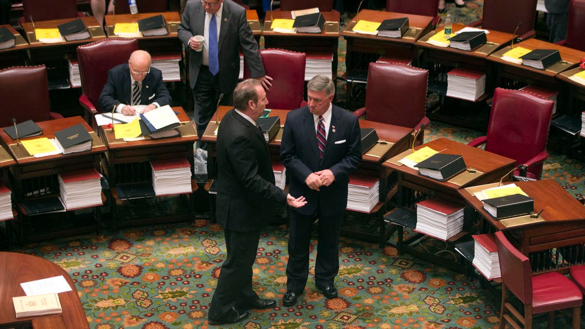 Sen. Joseph Robach, R-Rochester, left, and Sen. Rich Funke, R-Fairport, talk in the Senate Chamber on Wednesday, May 6, 2015. (AP)