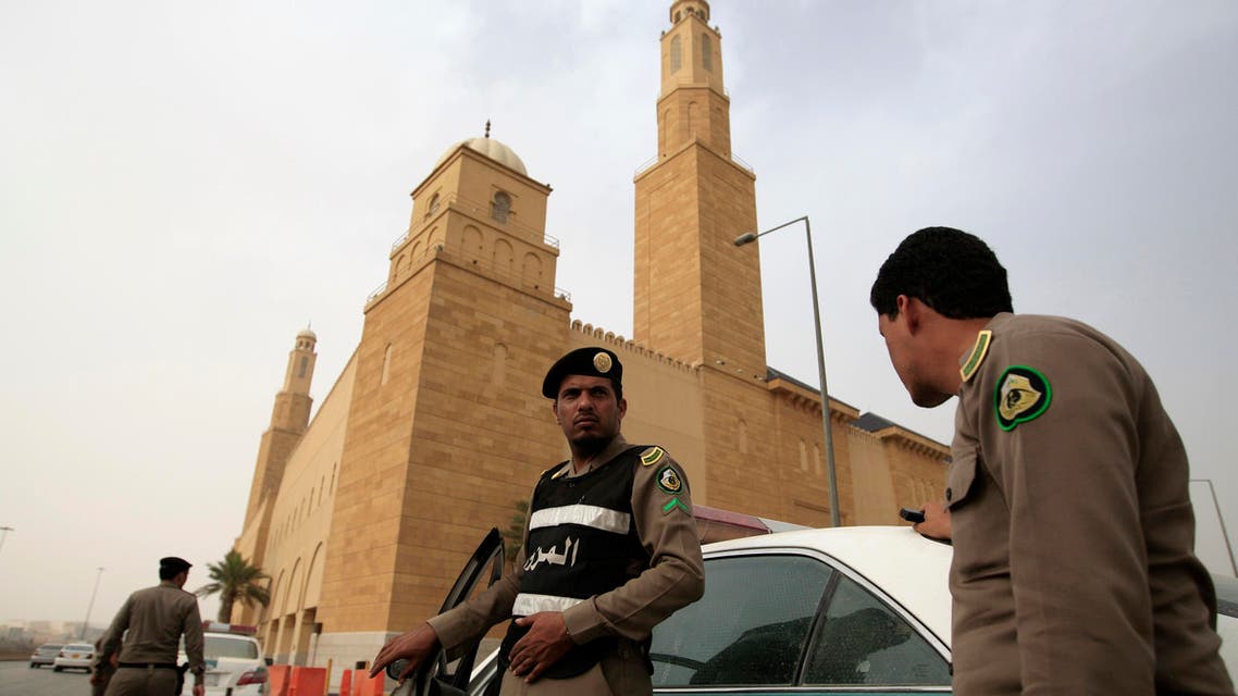 Saudi policemen form a check point outside Al Rajhi mosque where a demonstration was expected to take place in Riyadh, Saudi Arabia, Friday, March 11, 2011. Hundreds of police have deployed on the streets of the Saudi capital ahead of planned protests calling for democratic reforms in the kingdom. The rare security turnout highlights authorities' concerns about the possibility of people gathering after Friday prayers. Although protests have so far been confined to small protests in the country's east where minority Shiites live, activists have been emboldened by other uprisings and have set up online groups calling for protests in Riyadh Friday. (AP Photo/Hassan Ammar)