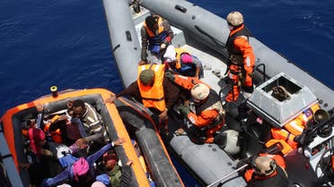 This Handout photo made available by the German Bundeswehr armed forces shows people being rescued by crew of the frigate 'Hessen' in the Mediterranean sea, 130 nautical miles off the Italian island of Lampedusa, on May 8 2015. In their first deployment in the Mediterranean sea, Bundeswehr Marines with two ships rescued around 430 shipwrecked refugees. According to Joint Operations Command, the frigate 'Hessen' took around 250 people on board in international waters, including 30 women and 5 children. AFP PHOTO / HANDOUT / BUNDESWEHR / PAO/ Mittelmeer