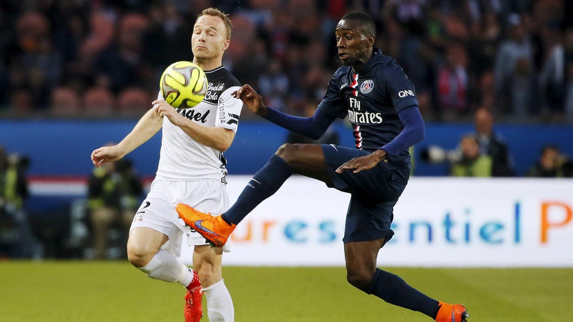 Paris St Germain's Matuidi challenges En Avant Guingamp's Jacobsen during their French Ligue 1 soccer match at Parc des Princes stadium in Paris. Reuters