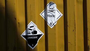 In this Tuesday May 13, 2014 file photo, signs reading "Toxic" are stuck to containers carrying Syria's dangerous chemical weapons aboard the Danish cargo ship. (AP)