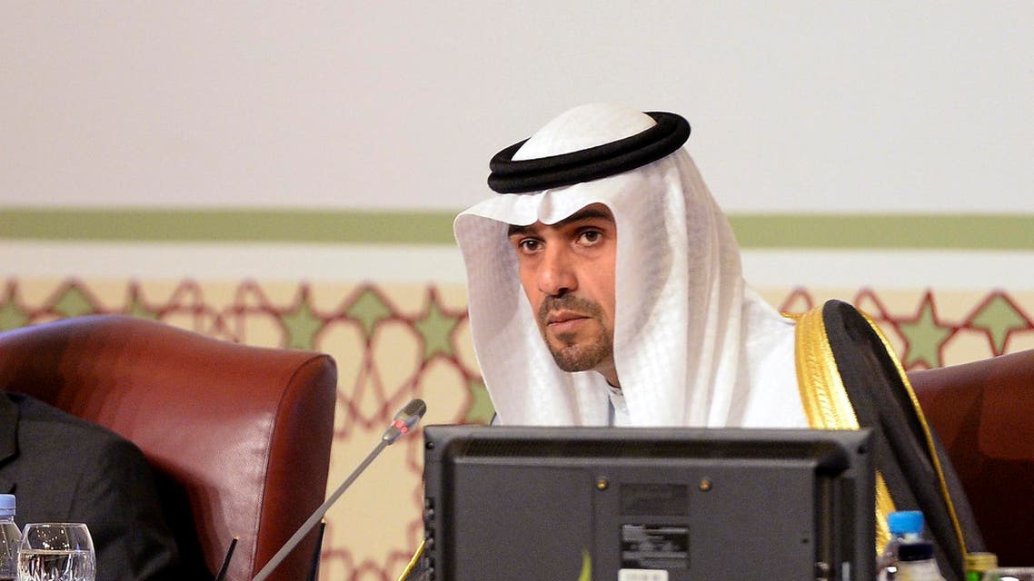 Kuwaiti Minister of Finance Anas Al-Saleh, right, pictured in this archive image dated March 22, 2014. (AP Photo/Nasser Waggi)