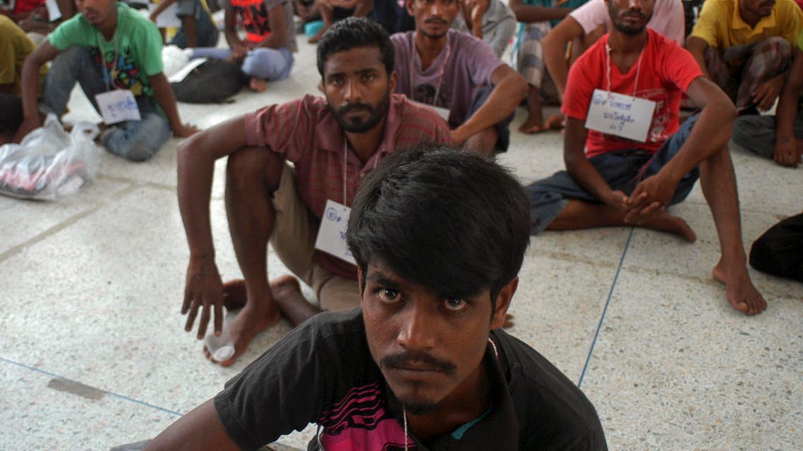 Rohingya migrants sit on the floor at the authority's district office of Rattaphum, Songkla province, southern Thailand, as they were found abandoned in Khao Kaew mountain near the Thai-Malaysia border, Saturday, May 9, 2015. They were provided a temporary shelter at the Rattaphum district. Thailand's police chief announced the arrest of a powerful provincial mayor on Friday and said 50 police officers are being investigated in a widening human trafficking scandal spanning four Asian countries.(AP Photo/Sumeth Panpetch)