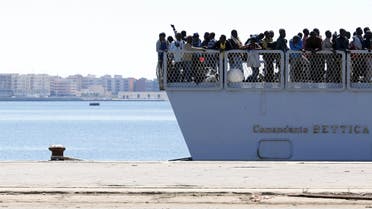Migrants arrive on the Italian Marines ship Comandante Bettica at the Sicilian harbor of Augusta April 22, 2015. REUTERS