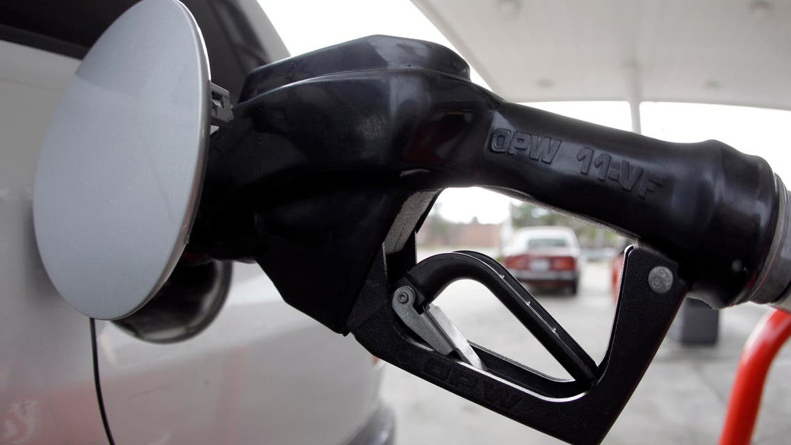 A vehicle fills up with gas Tuesday, March 22, 2011, in St. Louis. Oil prices rose above $104 per barrel Tuesday as traders continued to focus on a series of international crises that will drive world supply and demand this year. (AP Photo/Jeff Roberson)
