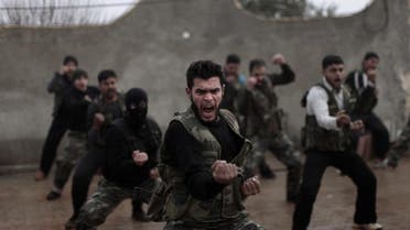 Syrian rebels attend a training session in Maaret Ikhwan, near Idlib, Syria, in December 2012. AP 