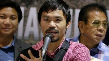 Filipino boxer and Congressman Manny Pacquiao answers questions from the media during a news conference upon arrival Wednesday, May 13, 2015  AP 