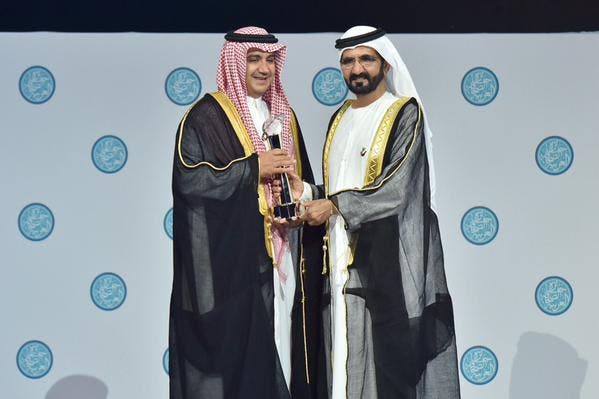 Dubai ruler Sheikh Mohammed bin Rashid Al Maktoum awards Sheikh Waleed al-Ibrahim for his achievements over last 25 years DUBIA MEDIA OFFICE