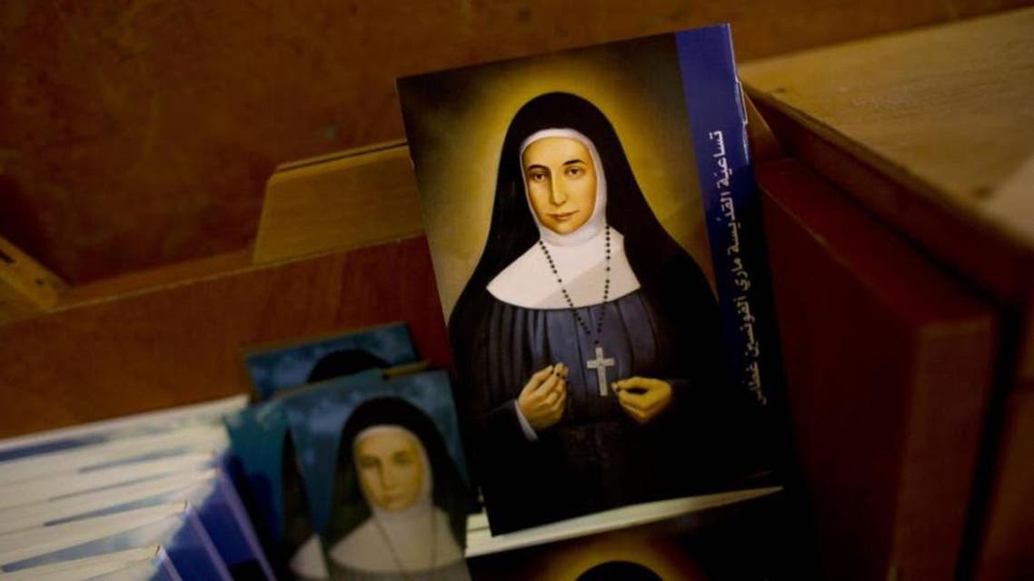 In this Thursday, May 7, 2015 photo, booklets showing the likes of Marie Alphonsine Ghattas, a nun who lived in what was Ottoman-ruled Palestine in the 19th century, are on display in Church of the Rosary Sisters Mamilla in Jerusalem. (AP)