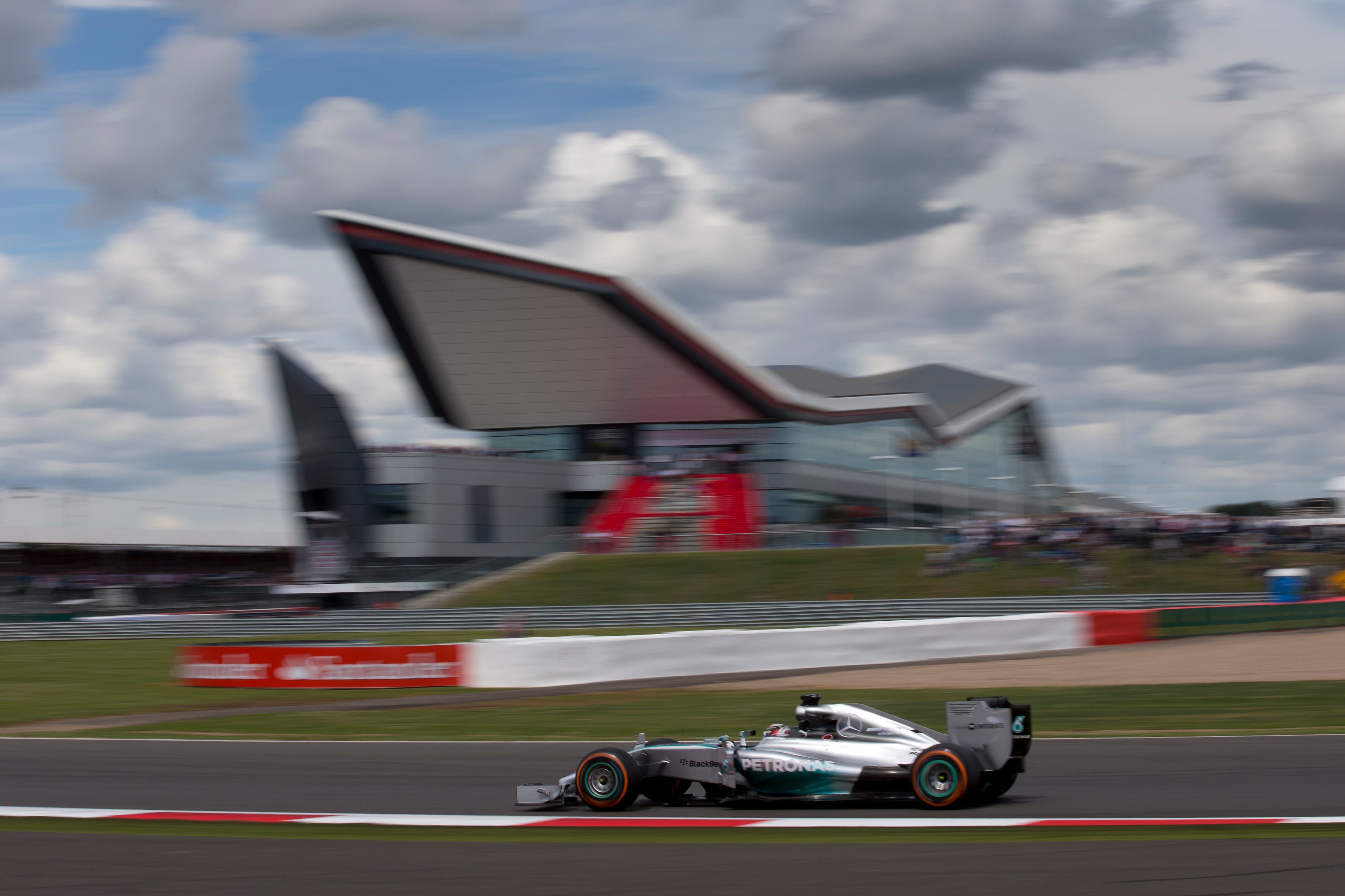 Britain's Lewis Hamilton of Mercedes drives his car to first place during the British Formula One Grand Prix at Silverstone circuit, Silverstone, England, Sunday, July 6, 2014. Finland's Valtteri Bottas of Williams finished second and Australia's Daniel Ricciardo of Red Bull finished third. (AP Photo/Jon Super)