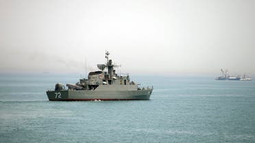 In this picture taken on Tuesday, April 7, 2015, and released by the semi-official Fars News Agency, Iranian warship Alborz, foreground, prepares before leaving Iran's waters, at the Strait of Hormuz. AP