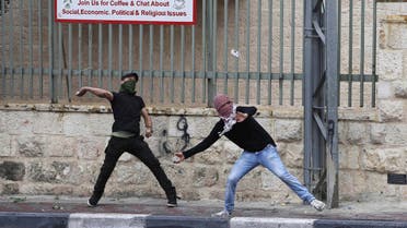 Palestinian protesters throw stones towards Israeli troops during clashes following a rally ahead of the Nakba day in the West Bank city of Bethlehem May 14, 2015. REUTERS