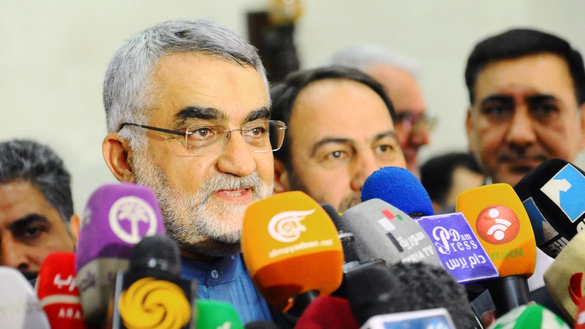 Chairman of the Foreign Policy and National Security Committee at the Iranian Shura Council, Alaeddin Boroujerdi (C), speaking to the press following a meeting with Syrian officials in the capital Damascus. (AFP)