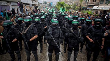  In this Dec. 14, 2014 file photo, masked Palestinian Hamas gunmen perform their military skills during a rally to commemorate the 27th anniversary of the Hamas militant group, in Gaza City. AP