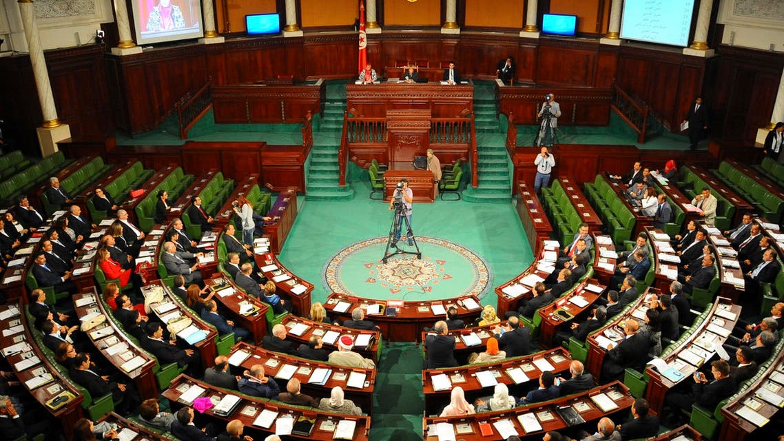 Tunisian parliament members gather during the inaugural session of the newly elected Tunisian parliament in Tunis, Tuesday, Dec. 2, 2014. AP