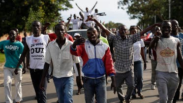 Supporters of President Pierre Nkurunziza celebrate his return in the streets of Bujumbura, Burundi, Friday May 15, 2015. AP