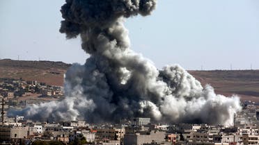 Smoke rises over the town of Kobani during airstrikes by the US led coalition, seen from the outskirts of Suruc, near the Turkey-Syria border, Wednesday, Oct. 29, 2014. (AP)