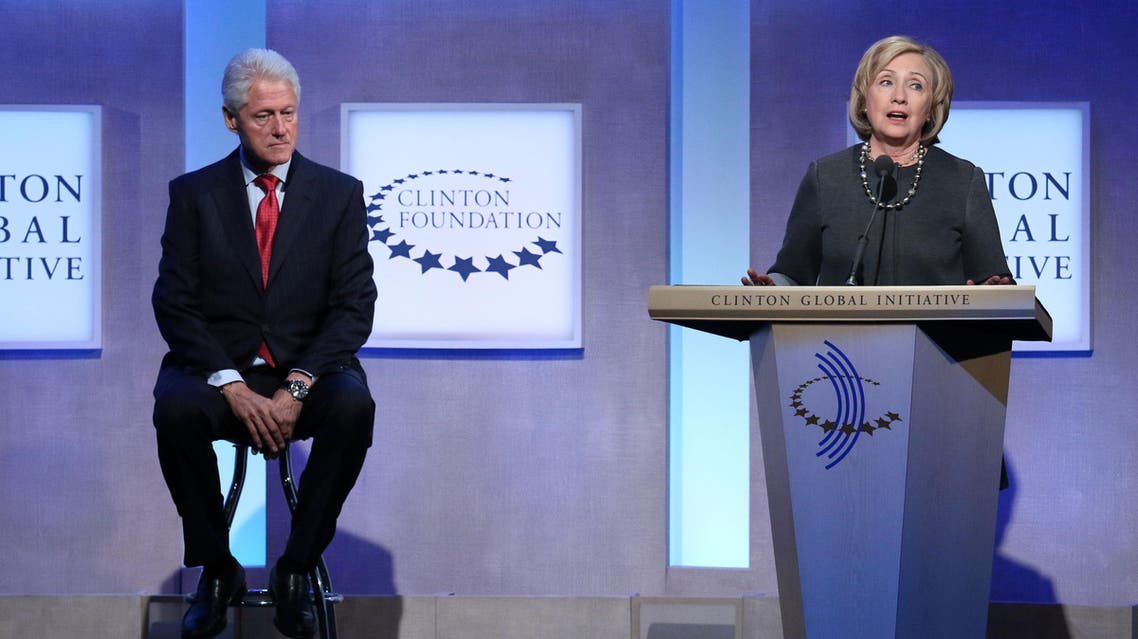 Former Secretary of State Hillary Rodham Clinton and former U.S. President Bill Clinton appear together on stage during a plenary session at the Clinton Global Initiative, Monday, Sept. 22, 2014 in New York. (Photo by Greg Allen/Invision/AP)
