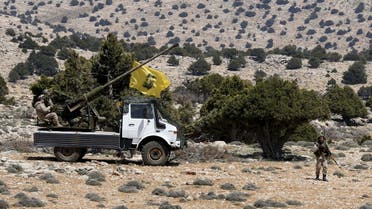 Lebanon's Hezbollah fighters rest on the back of a pick-up truck with an installed weapon in Khashaat, in the Qalamoun region after they advanced in the area May 15, 2015. (Reuters)