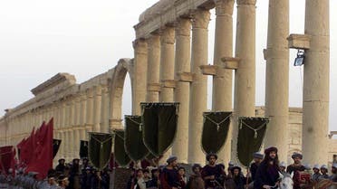 A symbolic trade caravan representing the prosperous trade during the era of Queen Zanobya 260-273AD during a show held in the ancient city of Palmyra, some 240 kilometers (150 miles) northeast of Damascus Friday, Sept. 27, 2002. The show was organized by the Syrian Tourism Ministry for World Tourism Day. The two-day festival was called "on the road of Harir or (silk)". (AP photo/Bassem Tellawi)