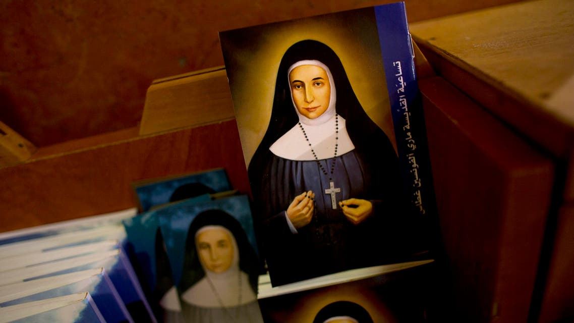 In this Thursday, May 7, 2015 photo, booklets showing the likes of Marie Alphonsine Ghattas, a nun who lived in what was Ottoman-ruled Palestine in the 19th century, are on display in Church of the Rosary Sisters Mamilla in Jerusalem. (AP)