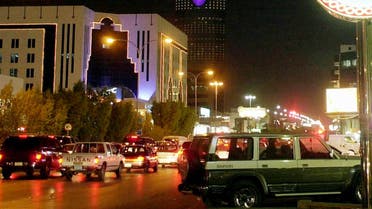 Cars crowd Olaya Street, overshadowed by Al-Mamlika Tower, in Riyadh's main business and shopping district, Oct. 3, 2002. The ruling Al-Saud family has modernized Saudi Arabia with oil money that has given the kingdom one of the region's best infrastructures, the latest technology and shopping centers. However, there are differences within the family on how to modernize further without adopting too many Western ways. (AP Photo/Hasan Jamali)