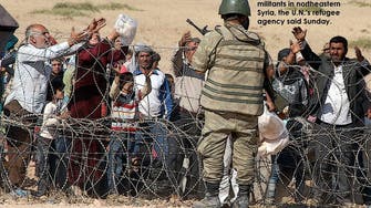 Syrian Kurds fleeing ISIS militants pour into Turkey