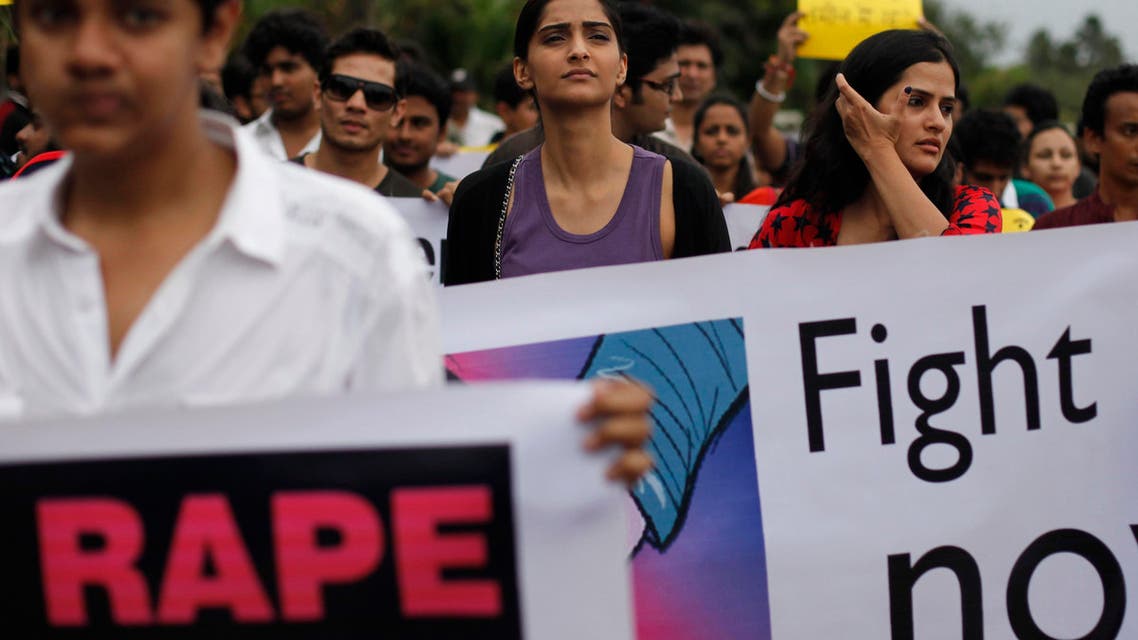 Indian Bollywood actress Sonam Kapoor center, participates a protest against the gang rape of a photojournalist in Mumbai, India, Sunday, Aug. 25, 2013.