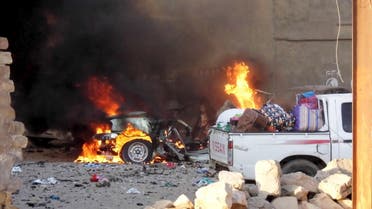 A car is engulfed by flames during clashes in the city of Ramadi. (Reuters)