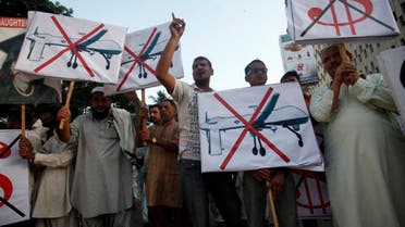 Supporters of Pakistan's Islamist party Pasban hold placards as they shout anti-American slogans during a protest in Karachi October 23, 2013, against US drone attacks in the Pakistani tribal region. (Reuters/Athar Hussain)