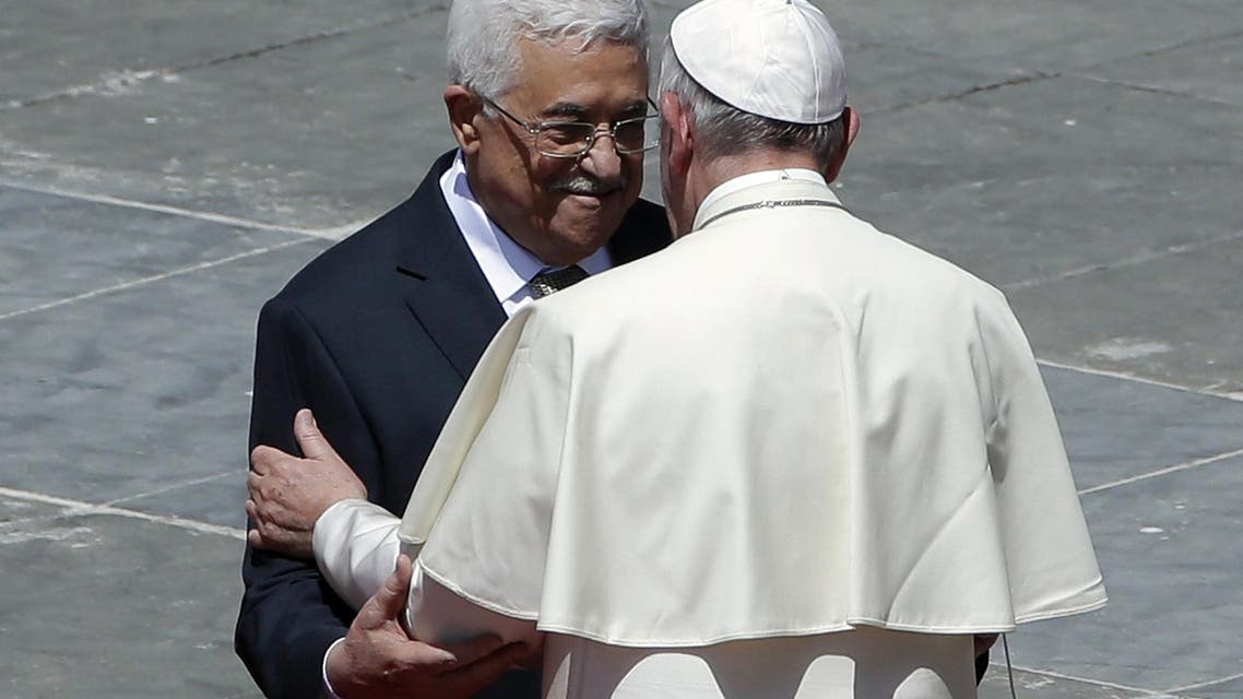 Pope Francis greets Palestinian President Mahmoud Abbas following a canonization ceremony in St. Peter's Square at the Vatican, Sunday, May 17, 2015. Pope Francis canonized two nuns from what was 19th century Palestine on Sunday in hopes of encouraging Christians across the Middle East who are facing a wave of persecution from Islamic extremists. Sisters Mariam Bawardy and Marie Alphonsine Ghattas were among four sisters who were made saints Sunday at a Mass in a sun-soaked St. Peter's Square. (AP Photo/Alessandra Tarantino)