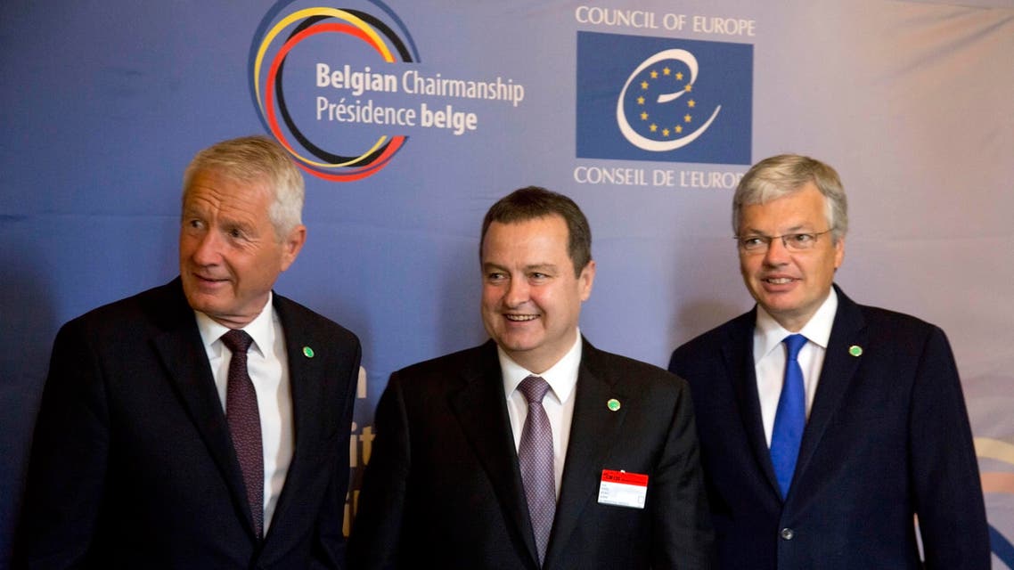 Secretary General of the Council of Europe Thorbjorn Jagland, left, and Belgian Foreign Minister Didier Reynders, right, welcome Serbia's Foreign Minister Ivica Dacic during a meeting of the Council of Europe in Brussels on Tuesday, May 19, 2015. The Council of Europe meets Tuesday with ministers of state to discuss terrorism. (AP Photo/Virginia Mayo)