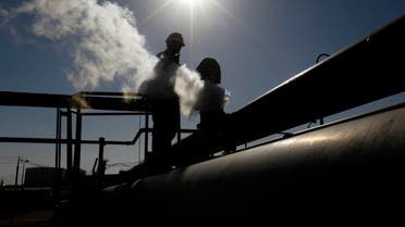 In this Feb. 26, 2011 file photo, a Libyan oil worker, works at a refinery inside the Brega oil complex, in Brega, eastern Libya. AP