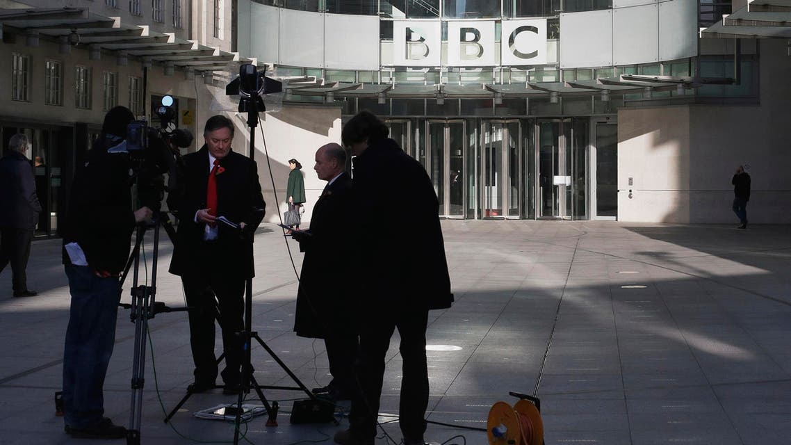 A television crew set up for alive transmission outside the BBC headquarters in London, Sunday, Nov, 11, 2012. The head of the BBC's governing body said Sunday the broadcaster needs a radical overhaul following the resignation of its chief executive in wake of a scandal over a botched report on child sex-abuse allegations. Chris Patten vowed to restore confidence and trust in the BBC, which is reeling from the resignation of George Entwistle and the scandals prompting his ouster. Entwistle resigned Saturday night amid a storm of controversy after a news program wrongly implicated a British politician in a child sex-abuse scandal, deepening a crisis sparked by revelations it decided not to air similar allegations against one of its own stars.(AP Photo/Alastair Grant)
