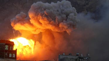 Fire and smoke billows from an army weapons depot after it was hit by an air strike in Yemen's capital Sanaa reuters