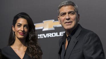 Cast member George Clooney and his wife Amal pose at the premiere of "Tomorrowland" in Anaheim, California May 9, 2015.  (Reuters)