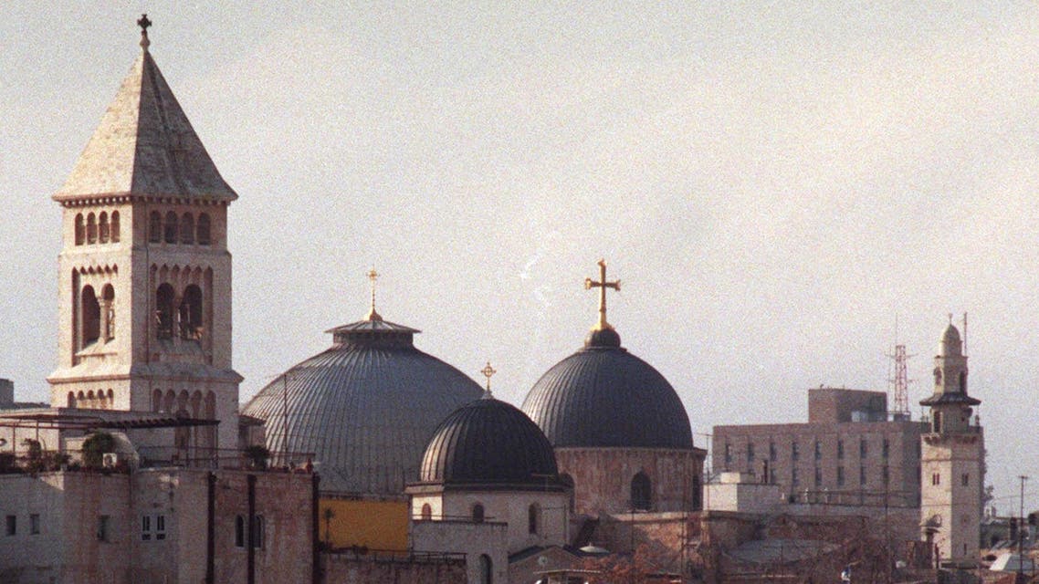 The dome of the Church of the Holy Sepulchre in Jerusalem, right, is surrounded by other churches and minarets dotting the city skyline, March 5, 1999. Within the 900-year-old church lie many of the sacred sites of Christianity: the places where tradition says Jesus was crucified, buried and resurrected. With the millennium approaching the church anticipates that it's yearly 700,000 visitors will increase to almost 4 million. (AP Photo/Ruth Fremson)