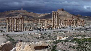 A file picture taken on March 14, 2014 shows the citadel (background) of the ancient oasis city of Palmyra, 215 kilometres northeast of Damascus, over looking the city. AFP