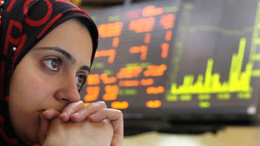 An Egyptian trader reacts after trading was halted for 30 minutes on the Egyptian Exchange after the benchmark index fell 5 percent, tracking a plunge in other world markets at the stock market, in Cairo, Egypt, Tuesday, Aug. 9, 2011. AP