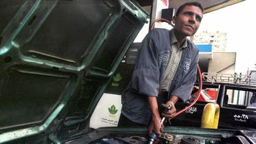 A gas station attendant refuels a vehicle with compressed natural gas at one of Cairo's 14 fueling stations. (File: AP)